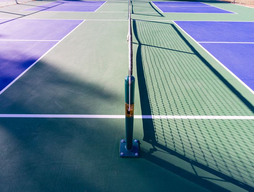 A court with a net ready to play